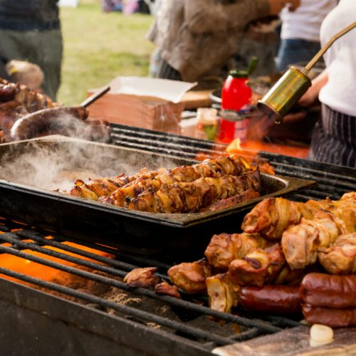 People using a grill to cook food